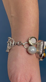 Load and play video in Gallery viewer, Vintage 1960s Silver Tiger Eye, Hematite, Mother of Perl, Clear Quartz Bracelet
