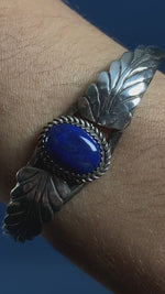 Load and play video in Gallery viewer, Vintage 1970s Native American Silver Cuff w/ Floral style &amp; Lapis Lazuli Stone
