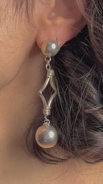 Load and play video in Gallery viewer, Vintage Mid Century style Long Silver Earrings
